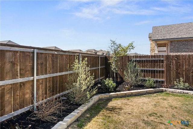 view of yard featuring a fenced backyard