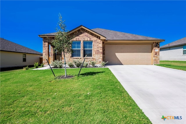 view of front facade featuring a garage and a front lawn