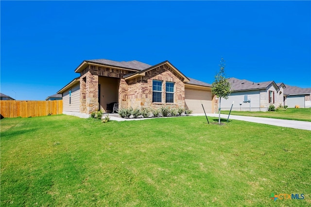 view of front facade featuring a garage and a front lawn