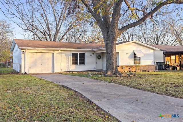 ranch-style house with a front lawn and a garage