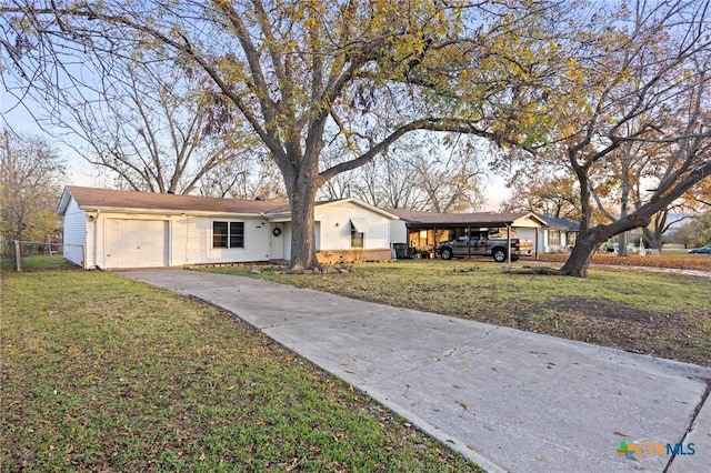 ranch-style home featuring a front yard and a garage