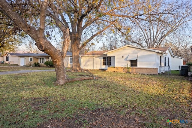 view of front of home featuring a front yard and a garage