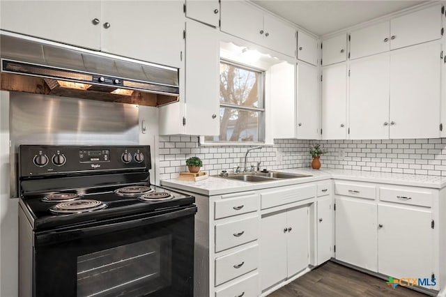 kitchen with backsplash, white cabinetry, black range with electric stovetop, and sink