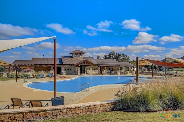 view of swimming pool featuring a patio