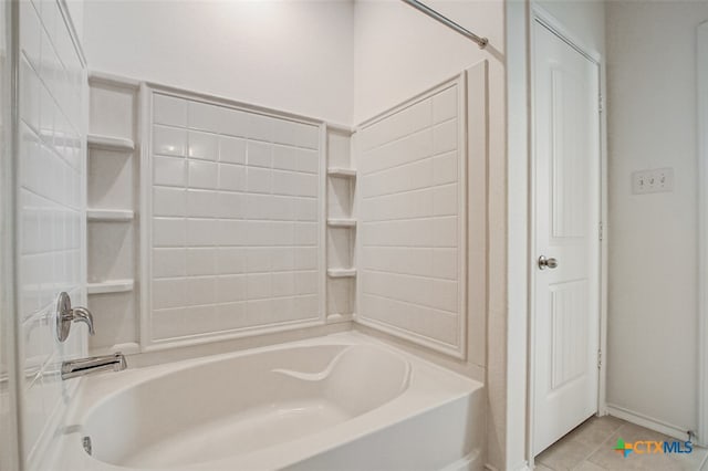 bathroom featuring shower / bath combination and tile patterned flooring