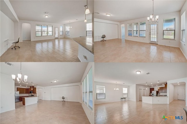 unfurnished living room with a notable chandelier