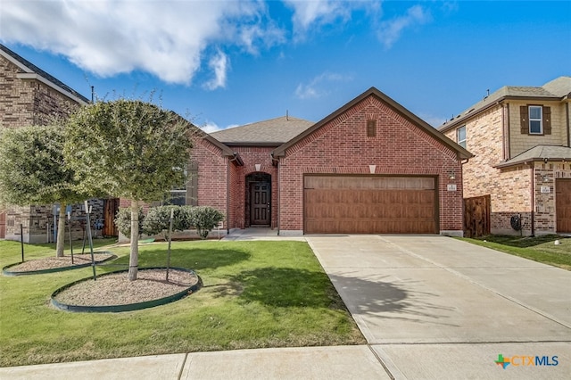 view of front of home with a front lawn and a garage