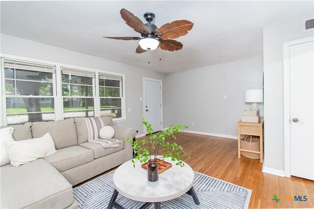 1902 S 41st St, Temple, TX 76504 - living area with baseboards, a ceiling fan, and light wood-style flooring