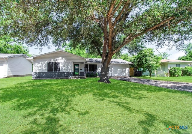 1902 S 41st St, Temple, TX 76504 - view of front of property with driveway, an attached garage, and a front yard