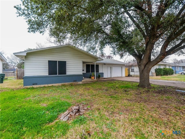 single story home with a garage and a front lawn