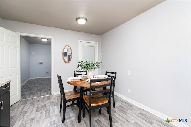 1902 S 41st St, Temple, TX 76504 - dining area featuring light wood-style flooring and baseboards