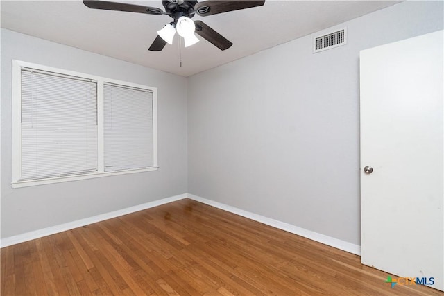 1902 S 41st St, Temple, TX 76504 - unfurnished room with wood finished floors, baseboards, and ceiling fan
