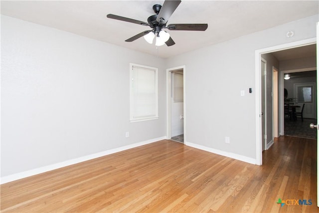 1902 S 41st St, Temple, TX 76504 - unfurnished bedroom with baseboards, light wood-type flooring, and ceiling fan