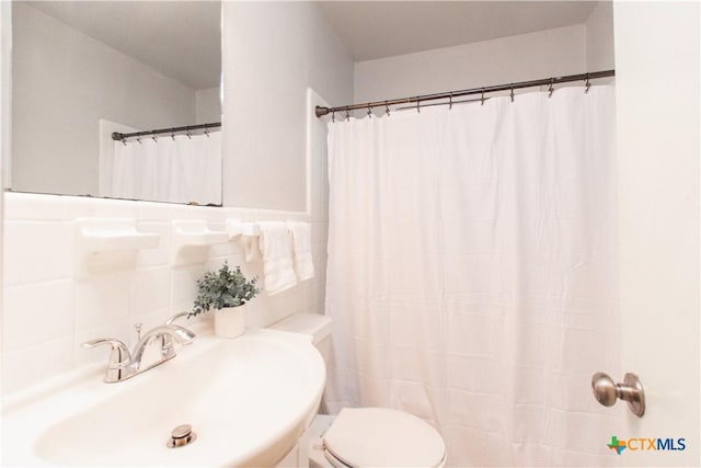 1902 S 41st St, Temple, TX 76504 - bathroom featuring a sink, toilet, and a shower with shower curtain