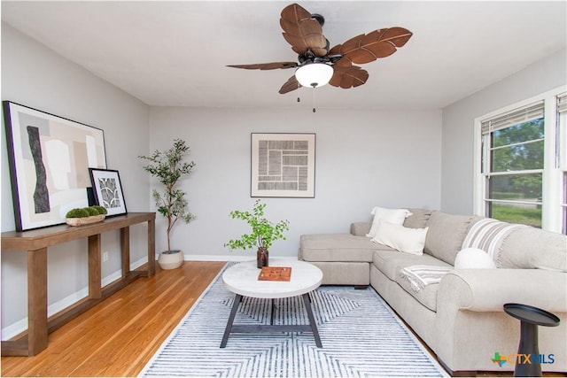 1902 S 41st St, Temple, TX 76504 - living area featuring light wood-style floors, a ceiling fan, and baseboards