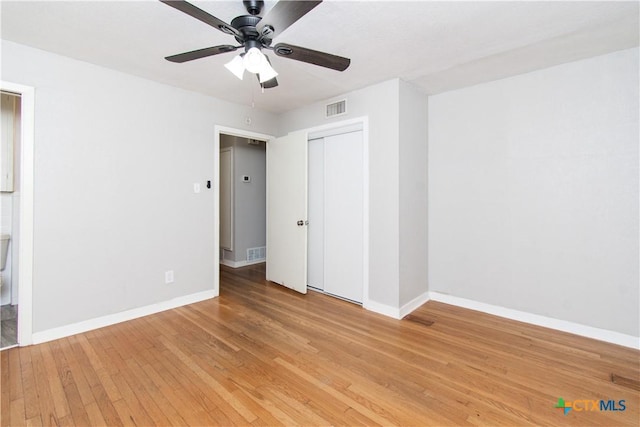 1902 S 41st St, Temple, TX 76504 - unfurnished bedroom featuring light wood-type flooring, baseboards, a closet, and a ceiling fan