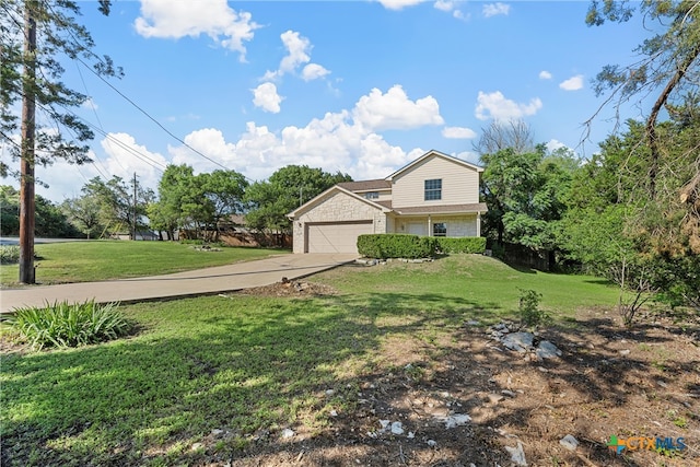 view of front of property featuring a garage and a front lawn