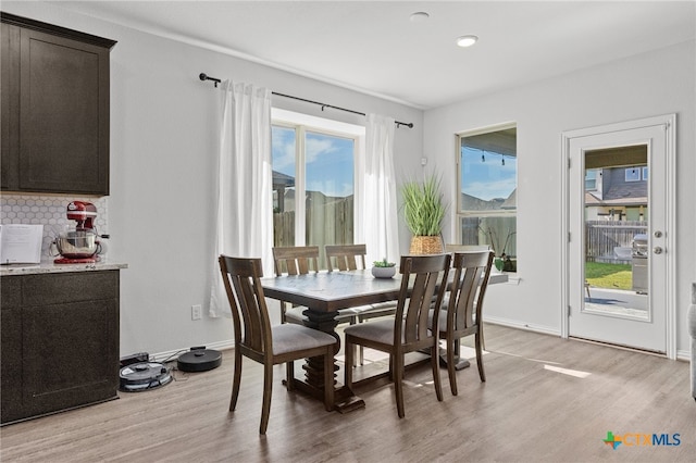 427 Bluejack Way, Hutto, TX 78634 - dining space featuring light wood-type flooring and baseboards