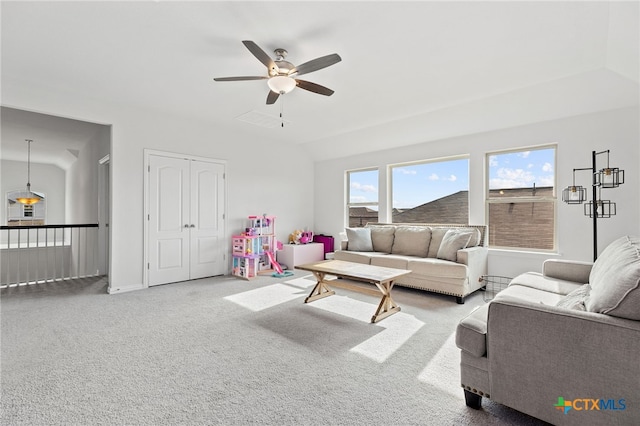 427 Bluejack Way, Hutto, TX 78634 - carpeted living area with ceiling fan and vaulted ceiling