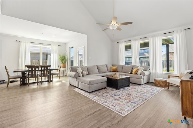 427 Bluejack Way, Hutto, TX 78634 - living room featuring a ceiling fan, light wood-style floors, and high vaulted ceiling
