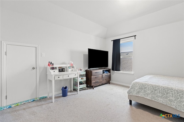 427 Bluejack Way, Hutto, TX 78634 - bedroom featuring carpet, lofted ceiling, and baseboards