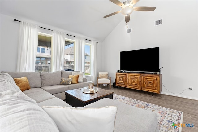 427 Bluejack Way, Hutto, TX 78634 - living area with ceiling fan, lofted ceiling, wood finished floors, and baseboards