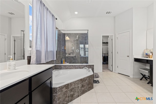 427 Bluejack Way, Hutto, TX 78634 - full bathroom with a stall shower, a garden tub, tile patterned flooring, a walk in closet, and vanity