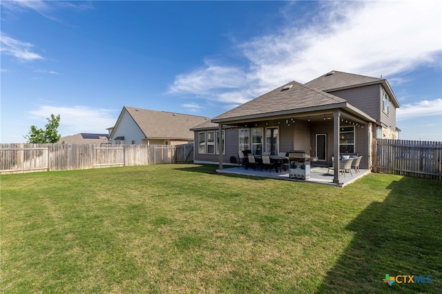 427 Bluejack Way, Hutto, TX 78634 - back of house featuring a patio and roof with shingles