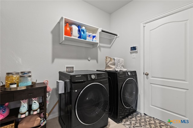 427 Bluejack Way, Hutto, TX 78634 - laundry room featuring washer and dryer and baseboards