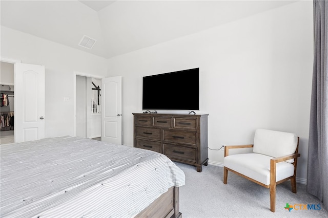 427 Bluejack Way, Hutto, TX 78634 - bedroom with light carpet, baseboards, and a walk in closet
