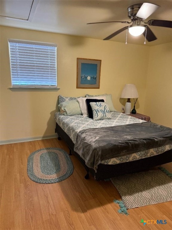 bedroom featuring ceiling fan and hardwood / wood-style floors