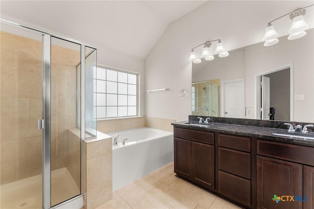 7805 Northgate Loop, Temple, TX 76502 - full bath with a bath, vaulted ceiling, double vanity, a shower stall, and tile patterned floors