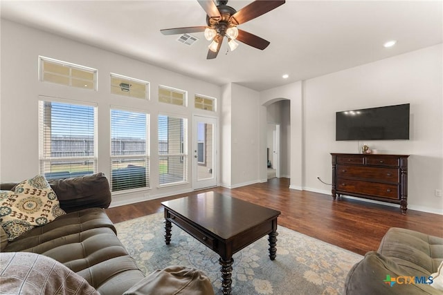 7805 Northgate Loop, Temple, TX 76502 - living room with arched walkways, wood finished floors, ceiling fan, and recessed lighting