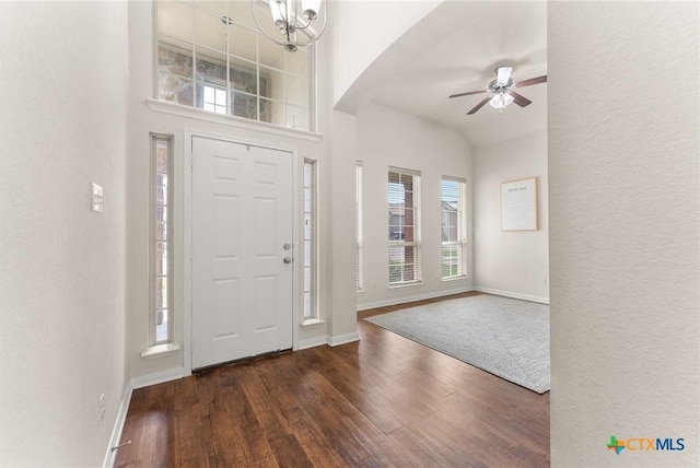 7805 Northgate Loop, Temple, TX 76502 - entrance foyer featuring wood finished floors, ceiling fan, arched walkways, lofted ceiling, and a chandelier