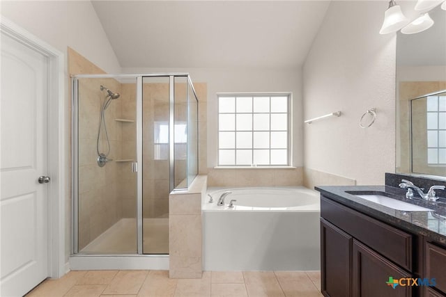 7805 Northgate Loop, Temple, TX 76502 - bathroom with lofted ceiling, vanity, a garden tub, plenty of natural light, and a stall shower