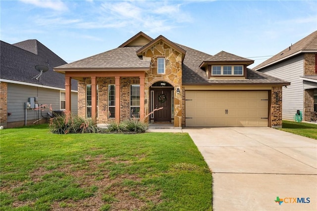 7805 Northgate Loop, Temple, TX 76502 - view of front facade with a garage, stone siding, a front yard, concrete driveway, and roof with shingles