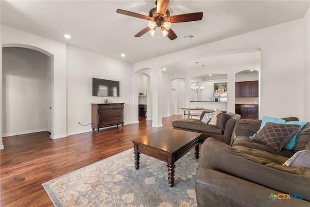 7805 Northgate Loop, Temple, TX 76502 - living area featuring arched walkways, wood finished floors, ceiling fan, and recessed lighting