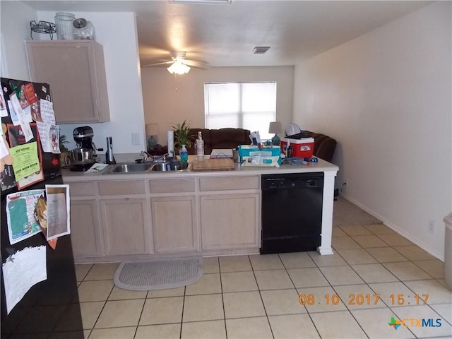 kitchen with light tile patterned floors, visible vents, black appliances, and a sink