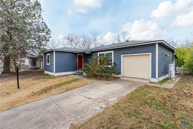 ranch-style home with a garage, water heater, and a front lawn