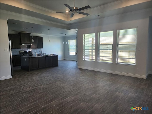 6002 Monza Dr, Temple, TX 76502 - kitchen with open floor plan, dark wood finished floors, ceiling fan, stainless steel range oven, and crown molding