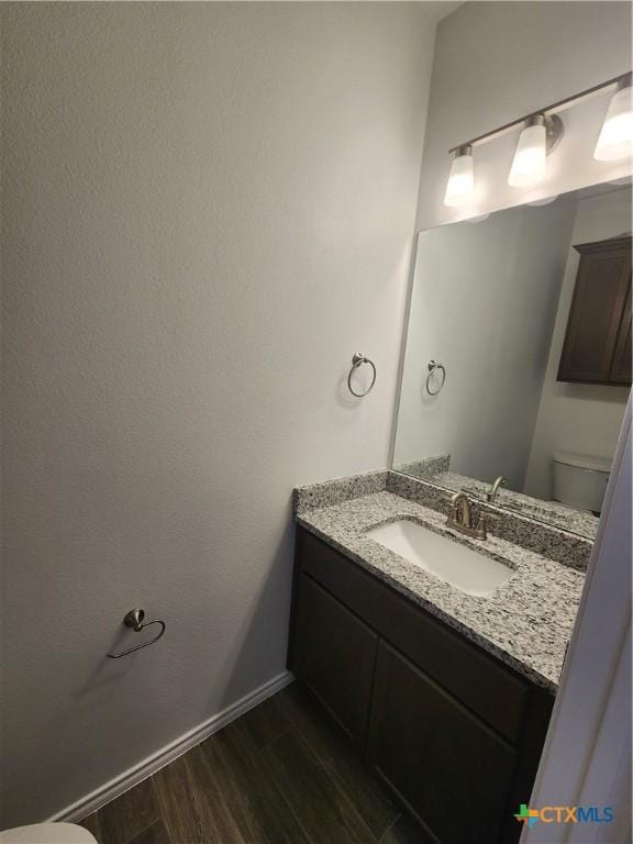 6002 Monza Dr, Temple, TX 76502 - half bath with wood finished floors and vanity