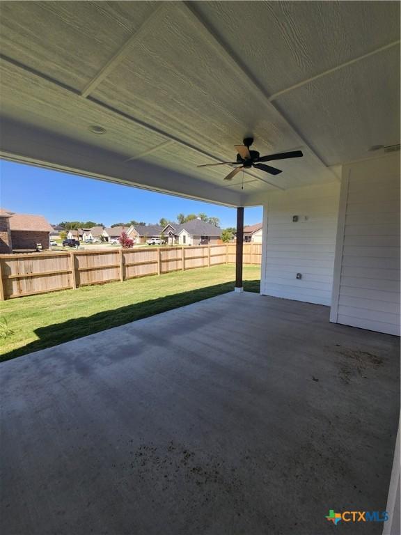 6002 Monza Dr, Temple, TX 76502 - fenced backyard featuring ceiling fan, a patio, and a residential view