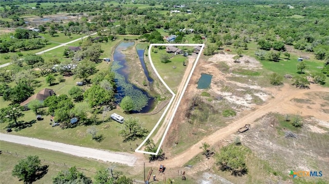 birds eye view of property with a rural view