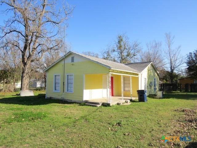 view of home's exterior with a lawn