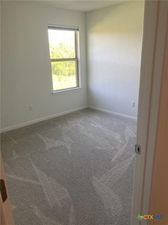 2629 Brand Iron Dr, San Marcos, TX 78666 - carpeted empty room with baseboards