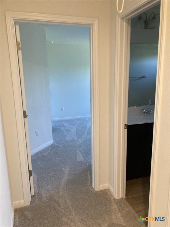 2629 Brand Iron Dr, San Marcos, TX 78666 - hallway featuring carpet flooring and baseboards