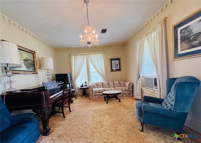 living area featuring cooling unit, carpet floors, a textured ceiling, a chandelier, and visible vents