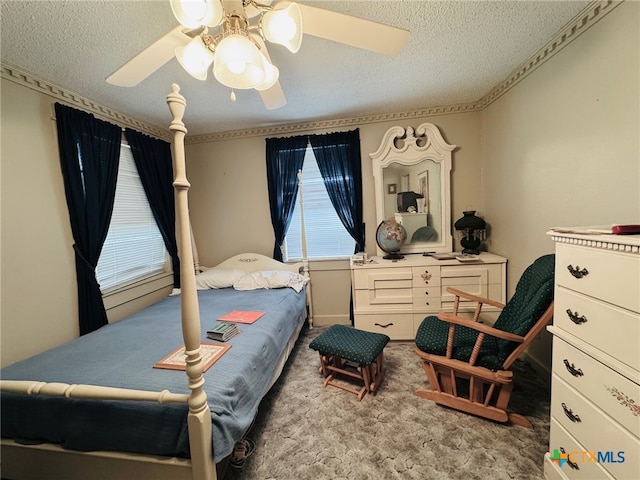 bedroom featuring carpet, a textured ceiling, and ceiling fan