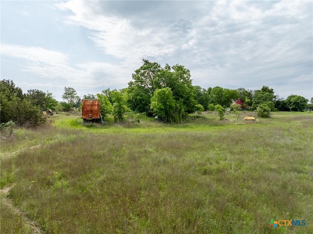 740 Old Georgetown Rd, Gatesville, TX 76528 - bedroom featuring a textured ceiling, light colored carpet, and a ceiling fan