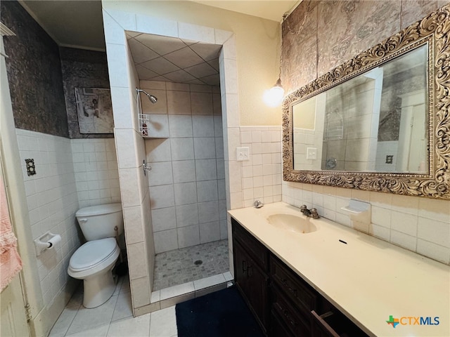 full bath featuring tile walls, tile patterned floors, a tile shower, and toilet